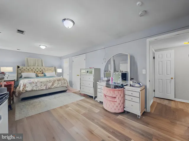 a bedroom with furniture and window