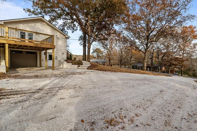 a view of a house with a snow in the yard