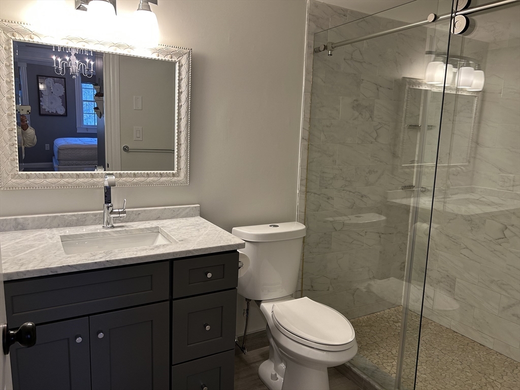 71 Weatherly Drive, Unit 71 Salem, MA 01970 - Photo 18 of 29 a bathroom with a granite countertop sink toilet and shower
