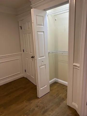 an empty room with wooden floor