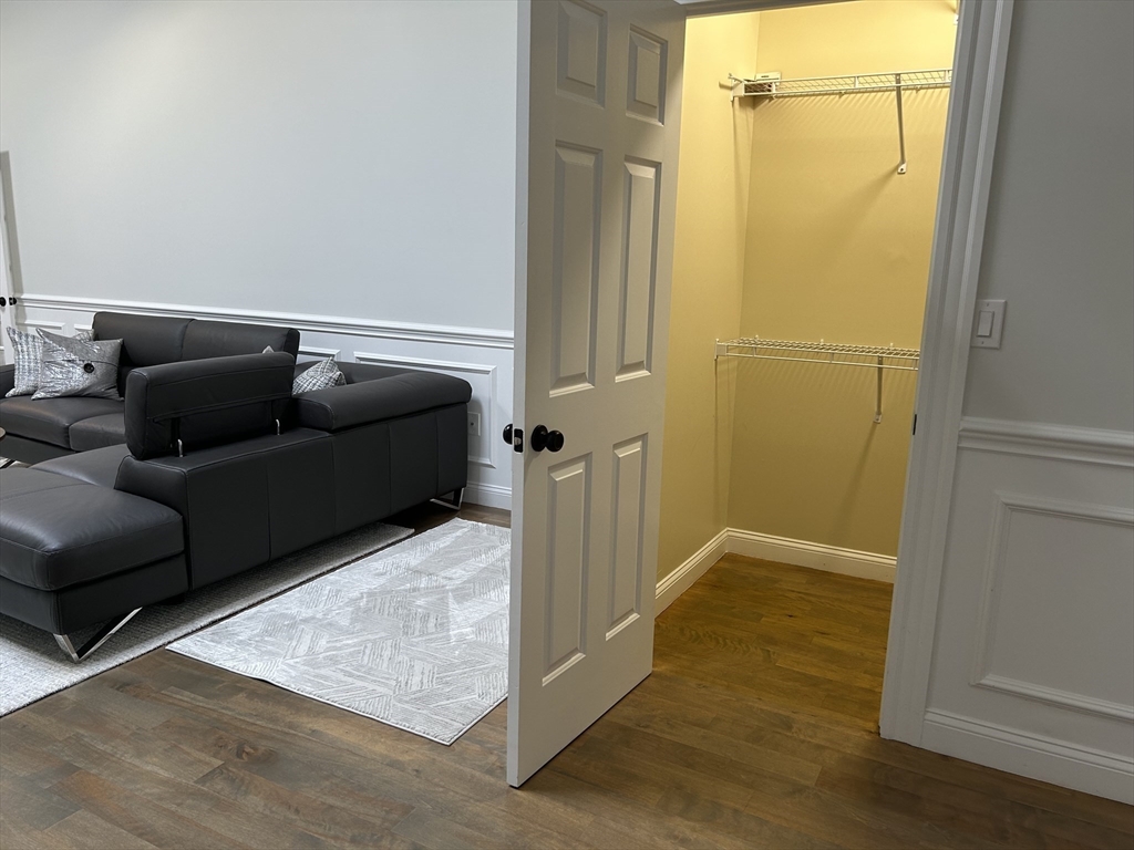 71 Weatherly Drive, Unit 71 Salem, MA 01970 - Photo 23 of 29 a living room with furniture and a gate