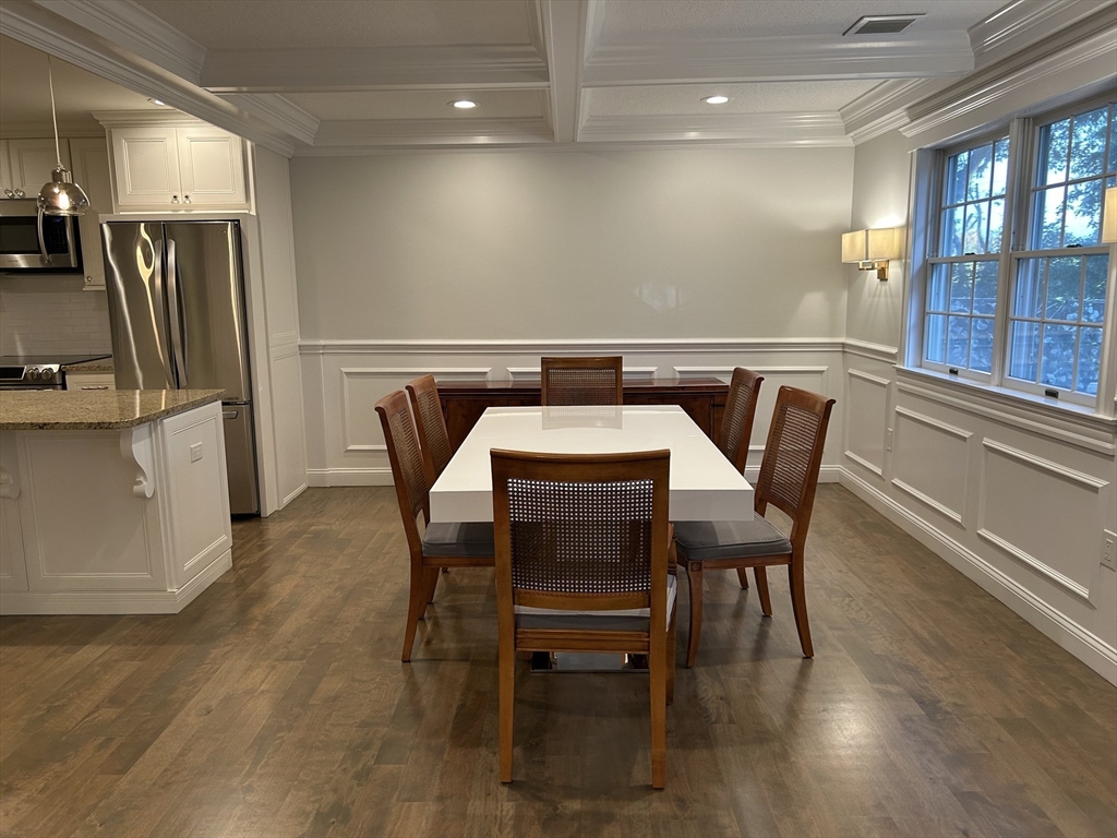 71 Weatherly Drive, Unit 71 Salem, MA 01970 - Photo 7 of 29 a dining room with furniture and wooden floor