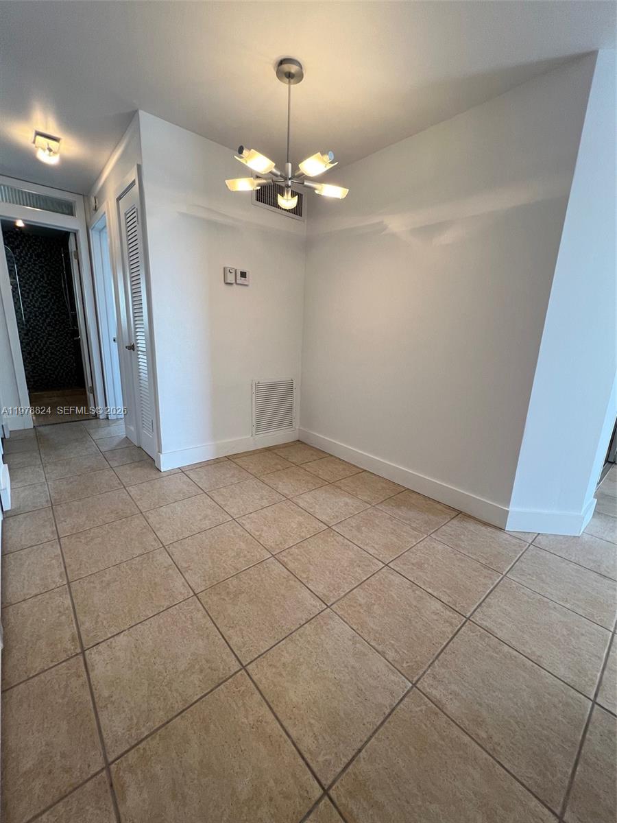 1340 Lincoln Road, Unit 705 Miami Beach, FL 33139 - Photo 11 of 21 a view of an empty room with a window