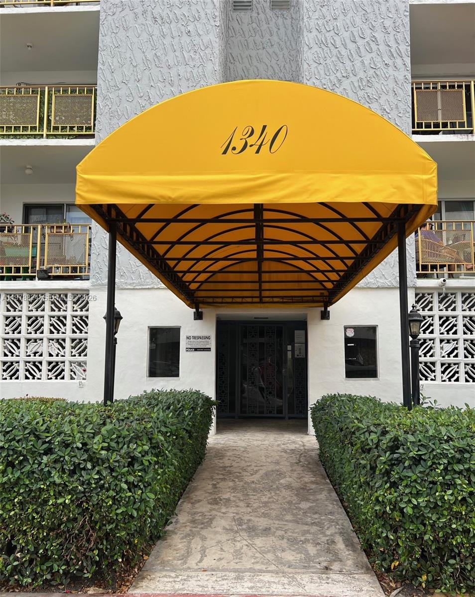 1340 Lincoln Road, Unit 705 Miami Beach, FL 33139 - Photo 19 of 21 a front view of a house with a yard