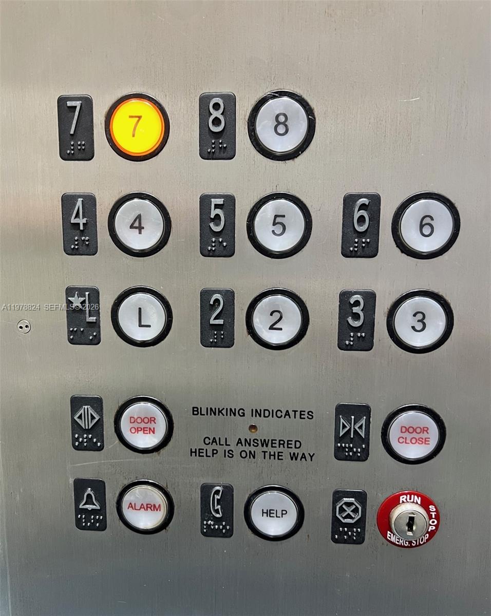 1340 Lincoln Road, Unit 705 Miami Beach, FL 33139 - Photo 21 of 21 with a wall and a table and a clock on a table