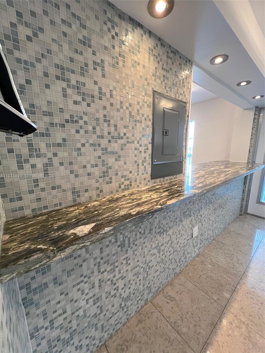 1340 Lincoln Road, Unit 705 Miami Beach, FL 33139 - Photo 9 of 21 a view of a bathroom with a sink and a large mirror