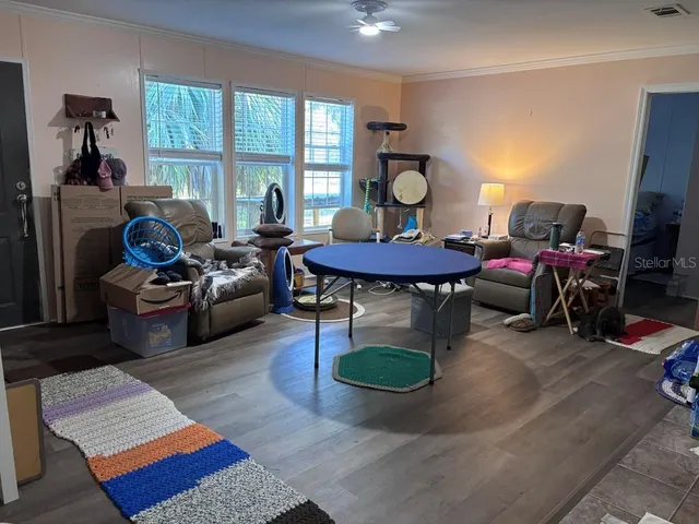 a view of walk in closet with clothes