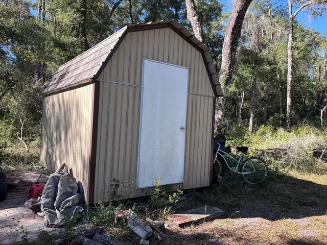 a backyard of a house with lots of green space