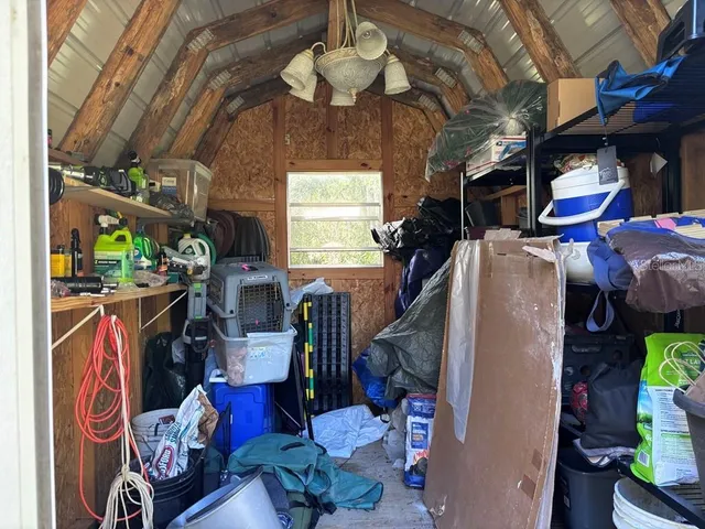 a view of a yard with a tree