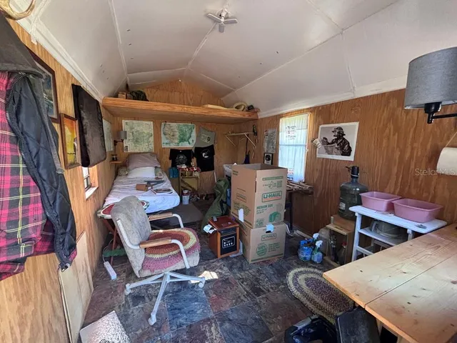 a view of a park with large trees