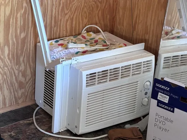 a view of a backyard with large trees