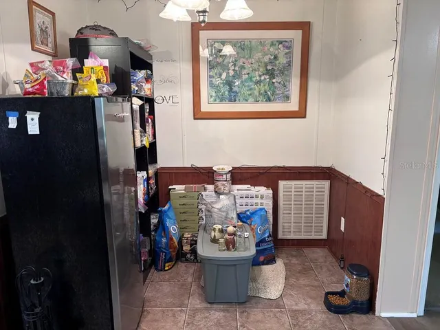 a living room with furniture a rug and a window