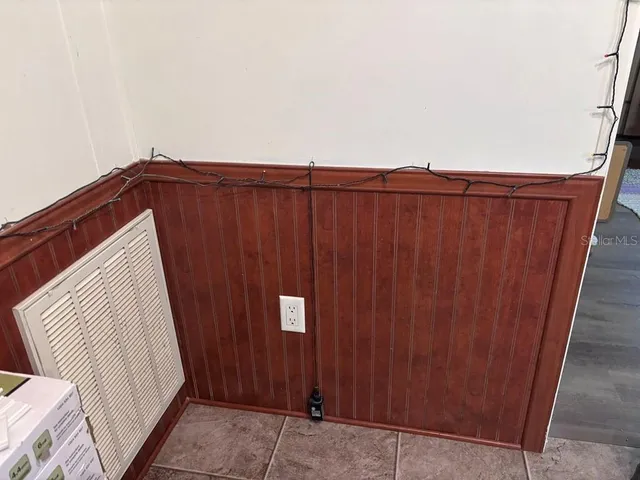a spacious bathroom with a double vanity sink and a mirror