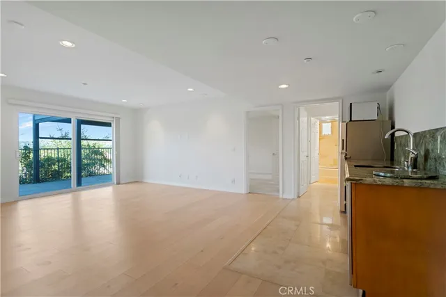 a view of a kitchen with furniture and a window