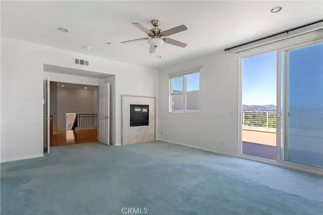 a bathroom with a tub a sink a mirror and a shower