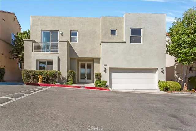 a front view of a house with tree s
