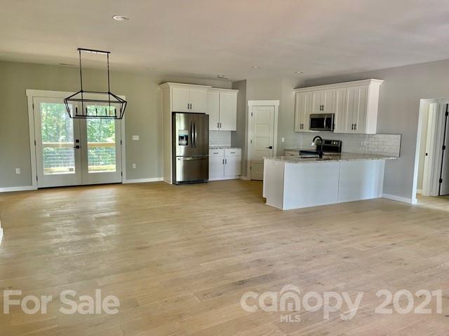 165 Shep Dr Mills River Mills River, NC 28759 - Photo 2 of 9 a view of an empty room with kitchen and window