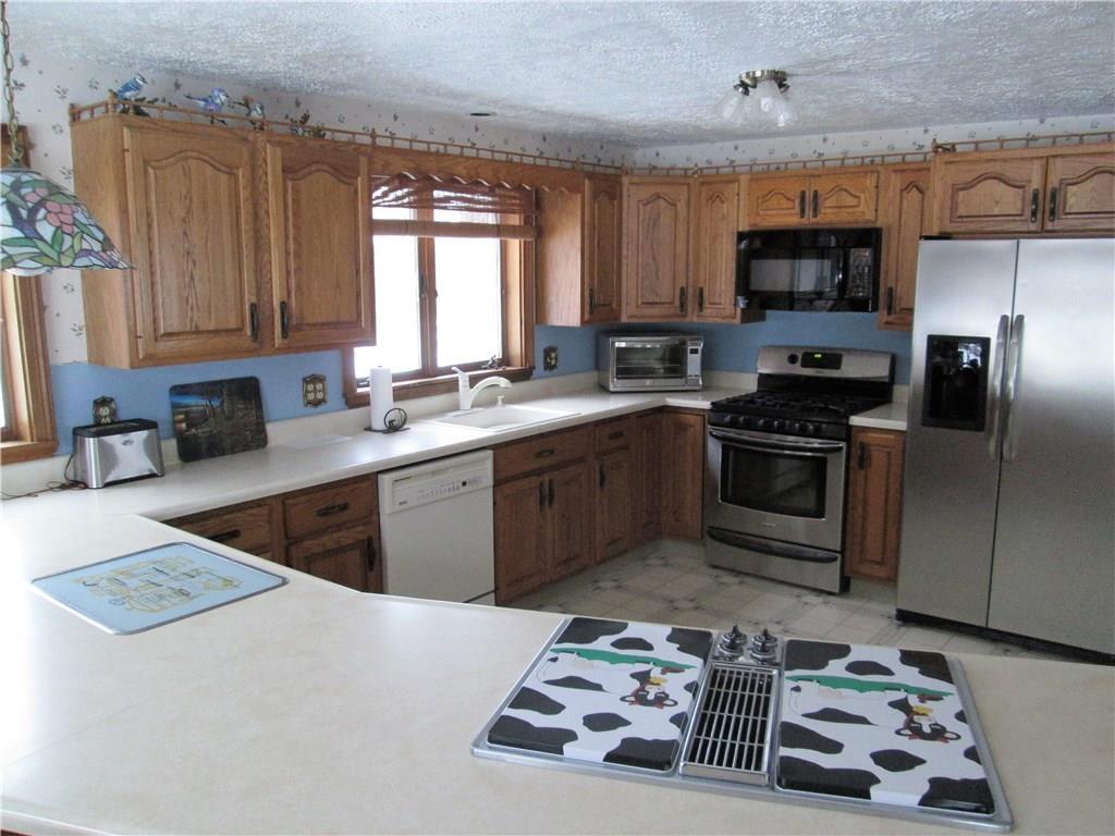 157 Cumner Road Vienna, ME 04360 - Photo 2 of 21 Open kitchen with breakfast bar,...