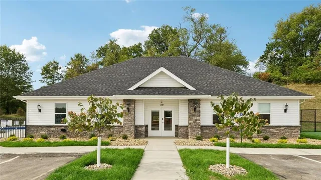 a front view of a house with garden