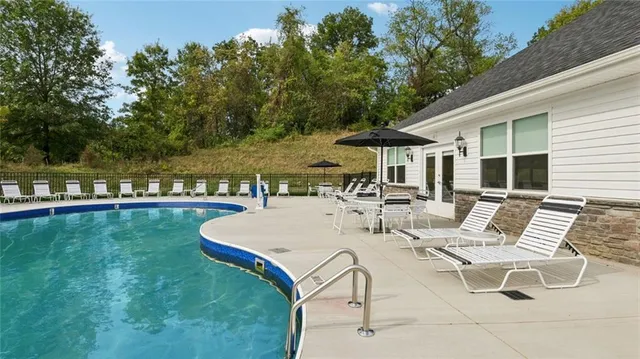 a view of a patio with swimming pool