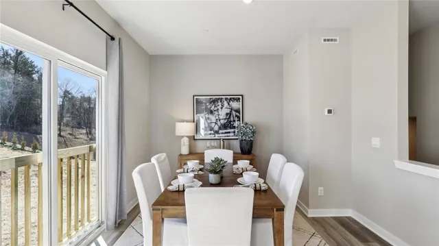 a view of a dining room with furniture window and outside view