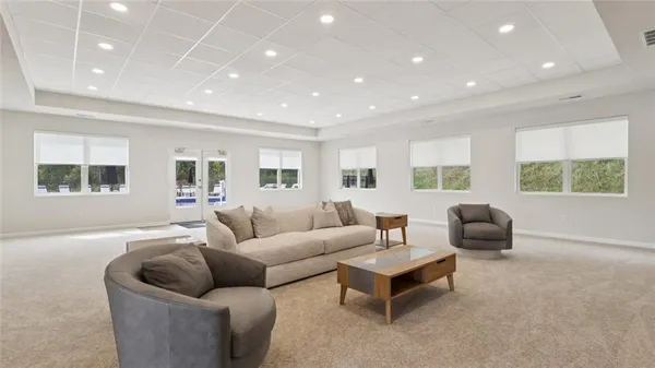 a living room with furniture and windows