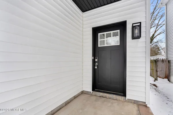 a kitchen with kitchen island a sink stainless steel appliances and cabinets