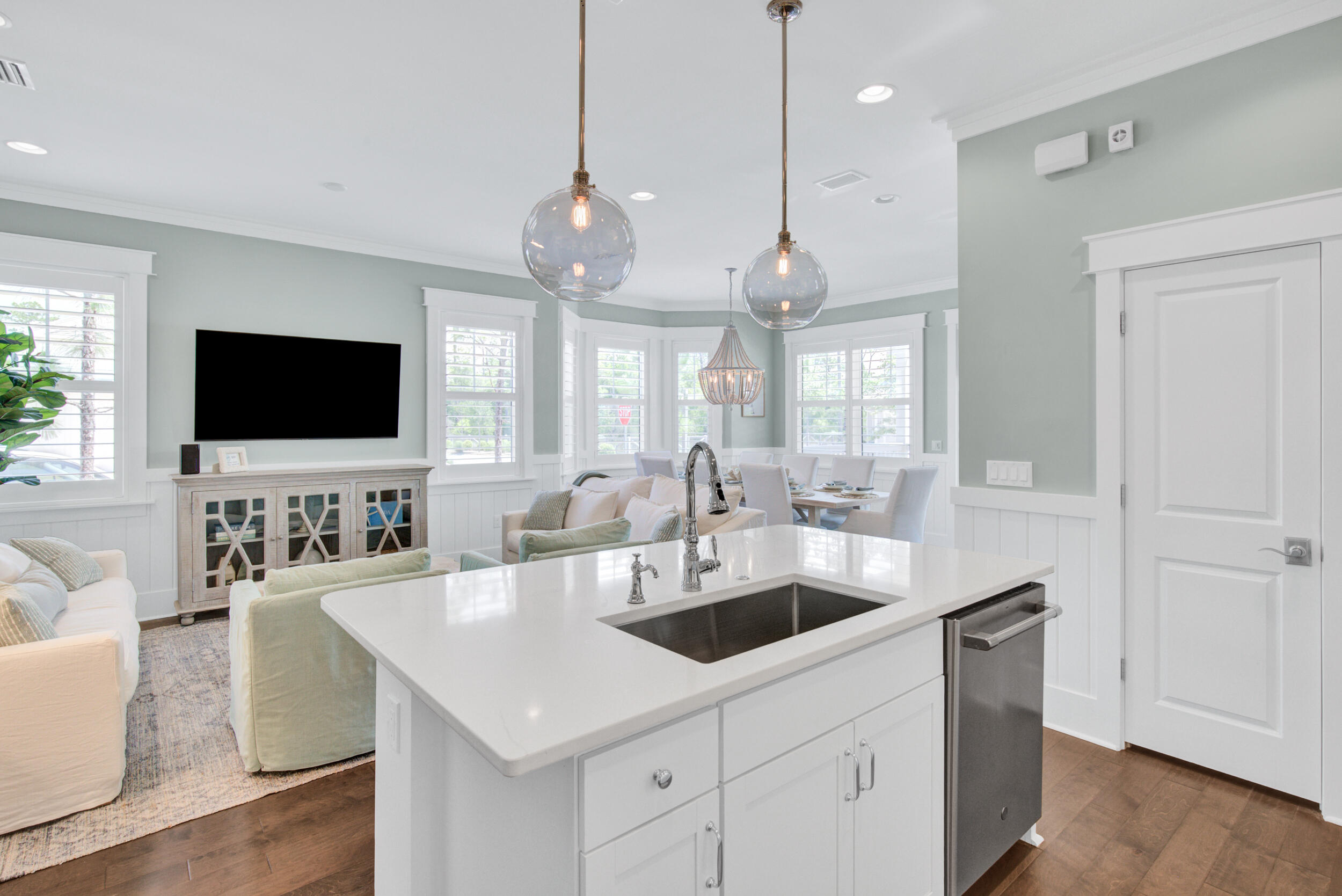 117 Prairie Pass Santa Rosa Beach, FL 32459 - Photo 12 of 33 a kitchen with a sink a counter space and living room view