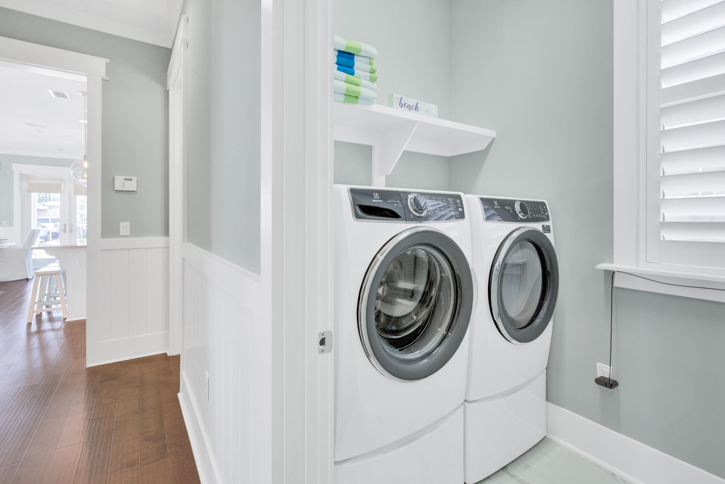 117 Prairie Pass Santa Rosa Beach, FL 32459 - Photo 16 of 33 a view of a hallway with washer and dryer