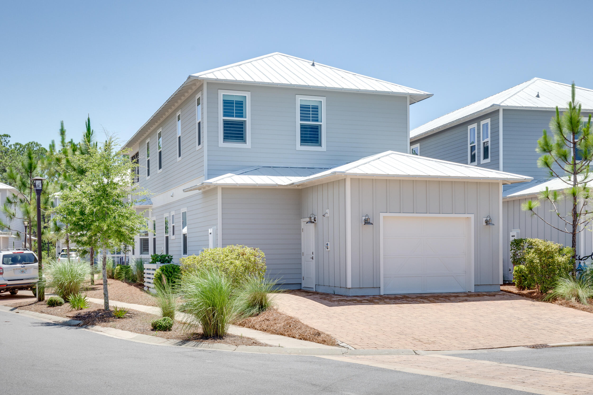117 Prairie Pass Santa Rosa Beach, FL 32459 - Photo 25 of 33 a front view of a house with garden