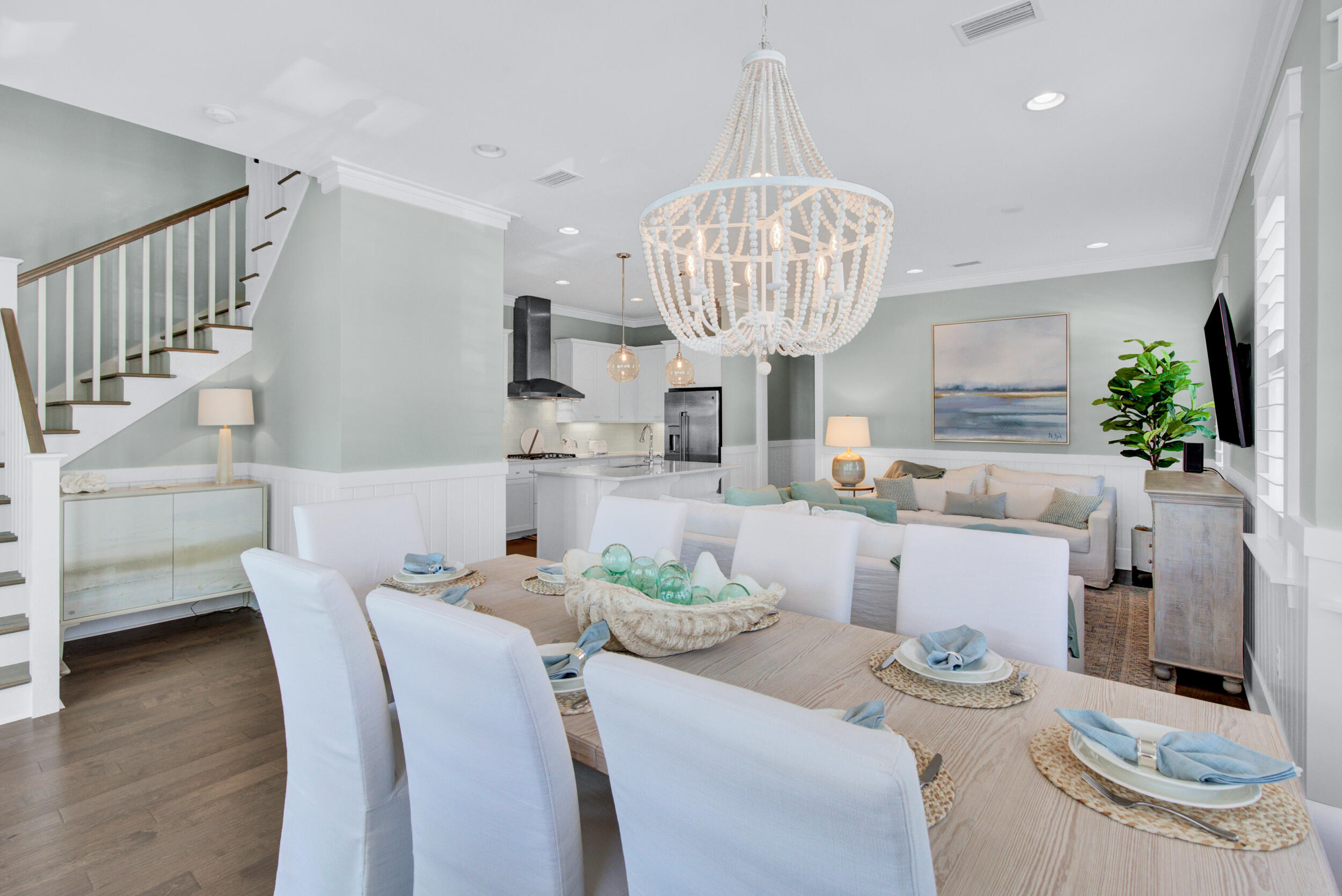 117 Prairie Pass Santa Rosa Beach, FL 32459 - Photo 6 of 33 a view of a dining room with furniture a chandelier and wooden floor