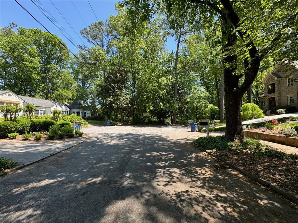 1285 Cumberland Road Northeast Atlanta, GA 30306 - Photo 1 of 5 a view of a street with a trees