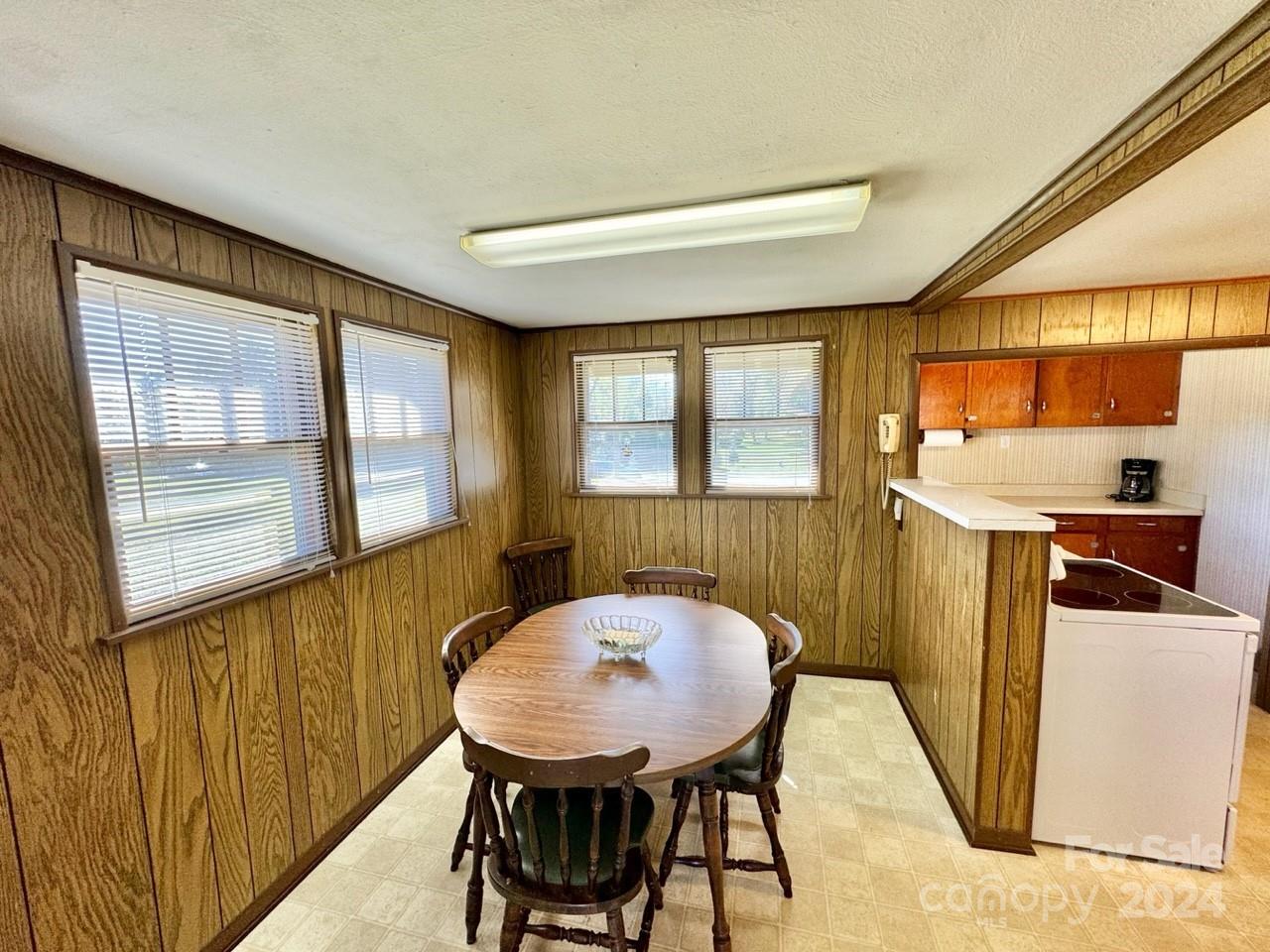 565 Neely Road Brevard, NC 28712 - Photo 11 of 28 a view of a dining room with furniture window and outside view