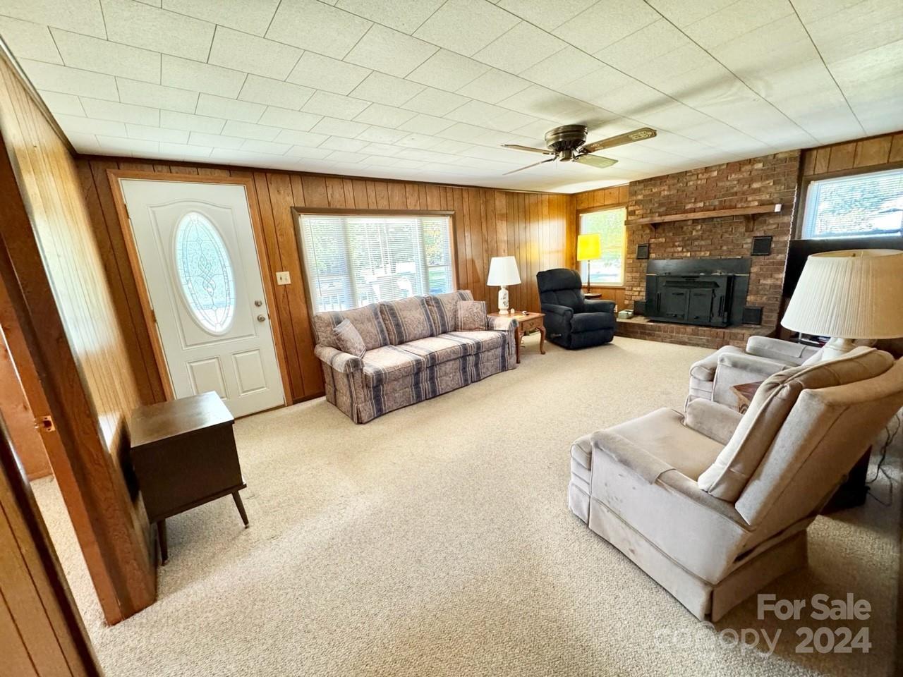 565 Neely Road Brevard, NC 28712 - Photo 12 of 28 a living room with furniture and a large window