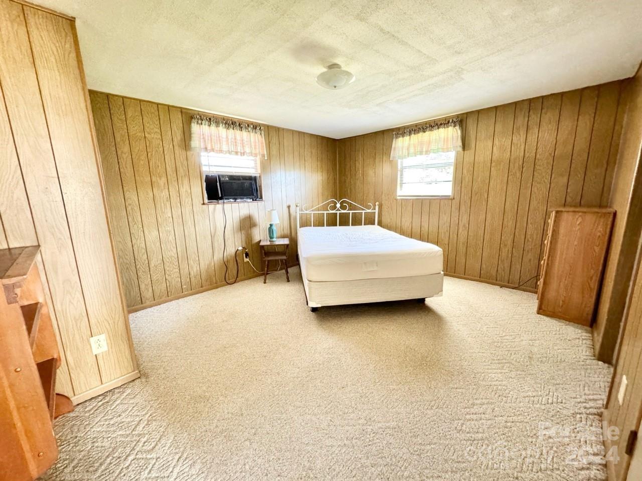 565 Neely Road Brevard, NC 28712 - Photo 27 of 28 a bedroom with a bed and a window