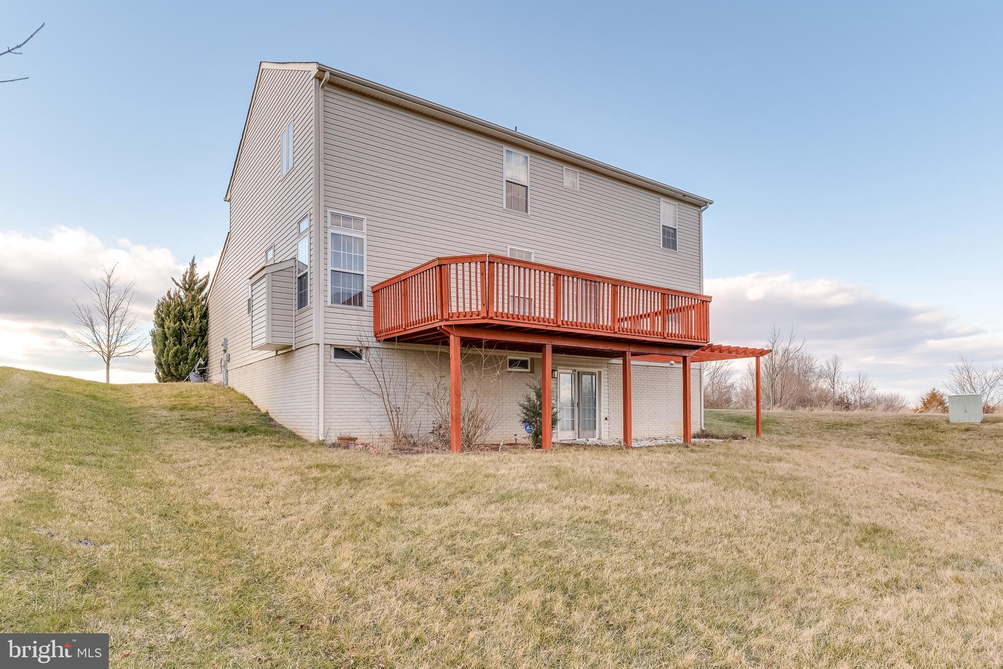 1356 Foal Street Ranson, WV 25438 - Photo 58 of 63 Beyond the patio you have a lush mostly level yard