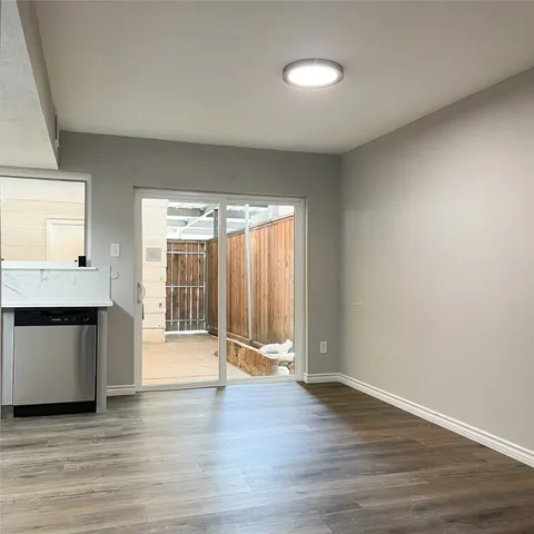 a bathroom with a toilet sink vanity mirror and vanity