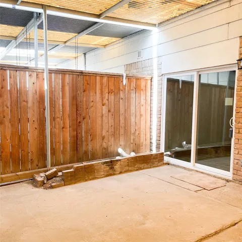 a kitchen with a stove sink and cabinets