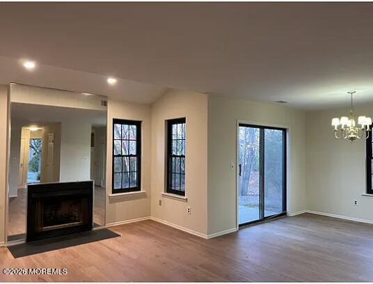 91 Paddock Court Oceanport, NJ 07757 - Photo 2 of 17 an empty room with windows and fireplace