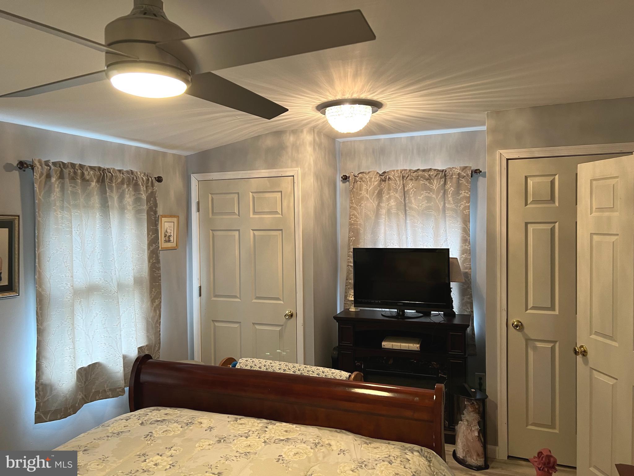3 Canhouse Road Elmer, NJ 08318 - Photo 22 of 44 a bedroom with a bed and a flat screen tv