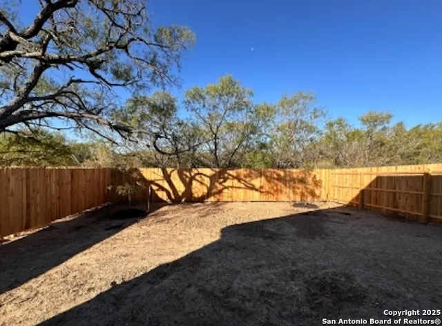 a view of a yard with an outdoor space