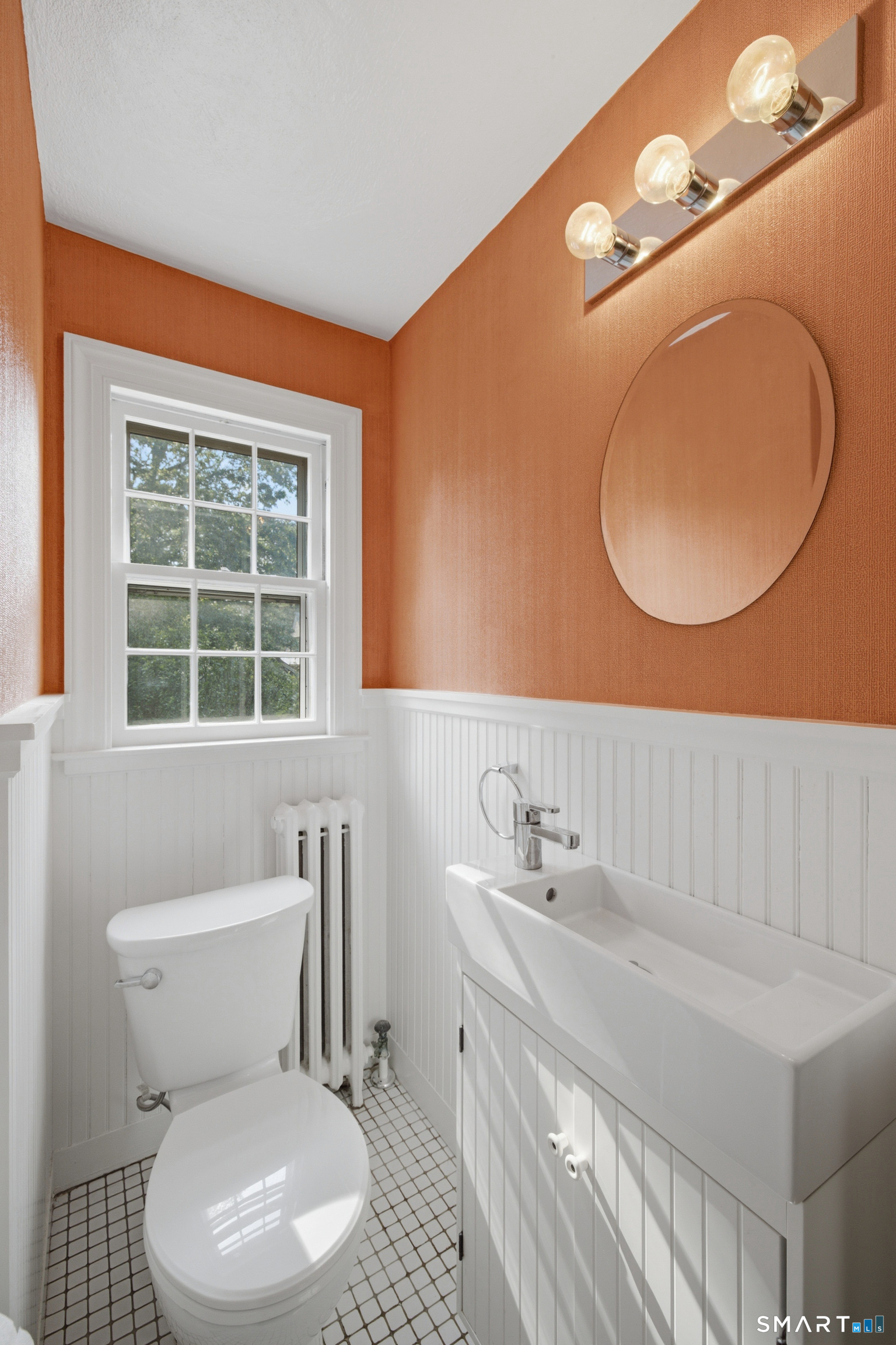9 Stratford Road West Hartford, CT 06117 - Photo 17 of 40 The adorable half bath off the kitchen is thoughtfully placed for guests and everyday use