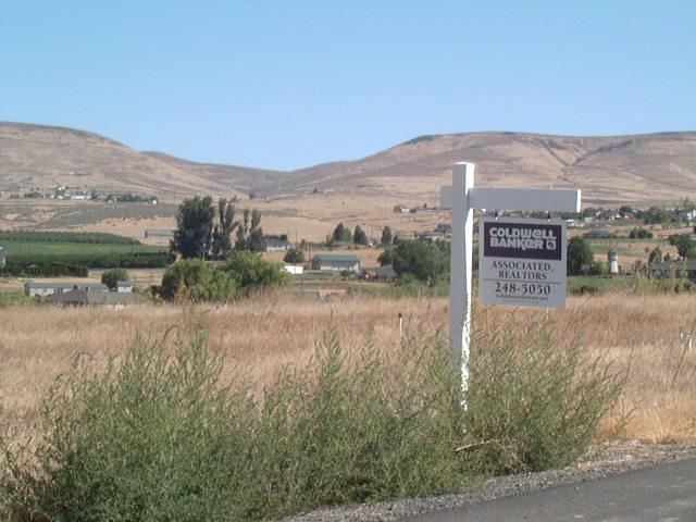 Nna Davell Lane, Unit LOT#3 Yakima, WA 98901 - Photo 1 of 6 a view of a lake with a mountain in the background