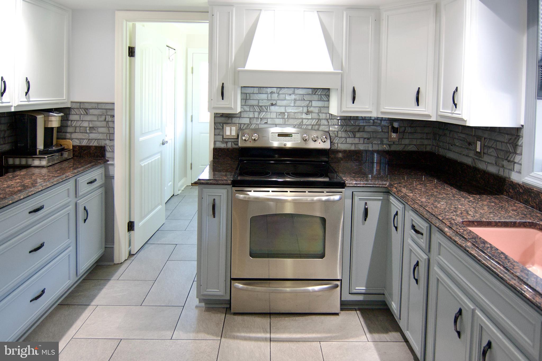 7451 Valley View Lane Reading, PA 19606 - Photo 20 of 61 a kitchen with a stove top oven and cabinets