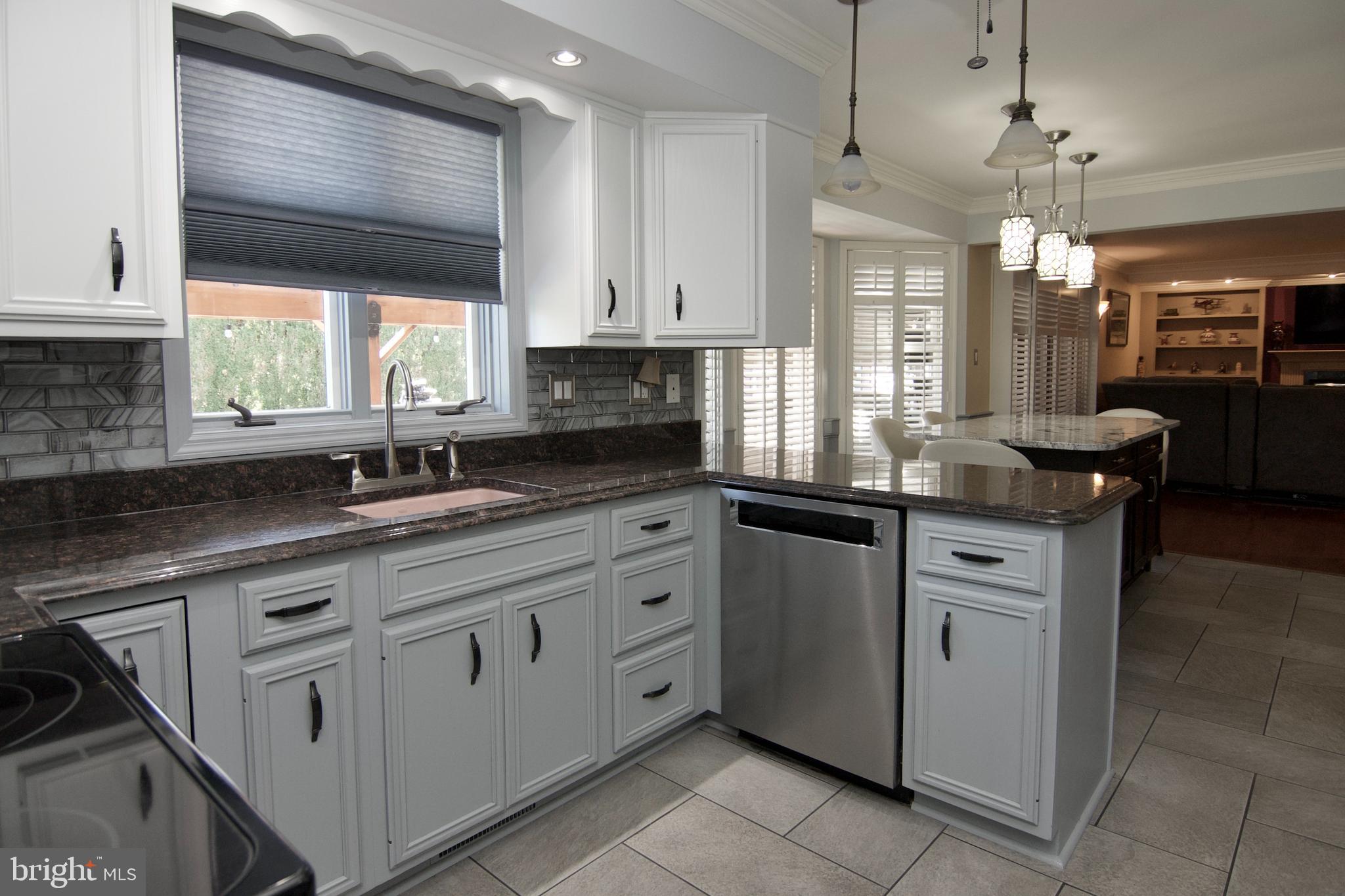 7451 Valley View Lane Reading, PA 19606 - Photo 21 of 61 a kitchen with granite countertop a sink window and cabinets