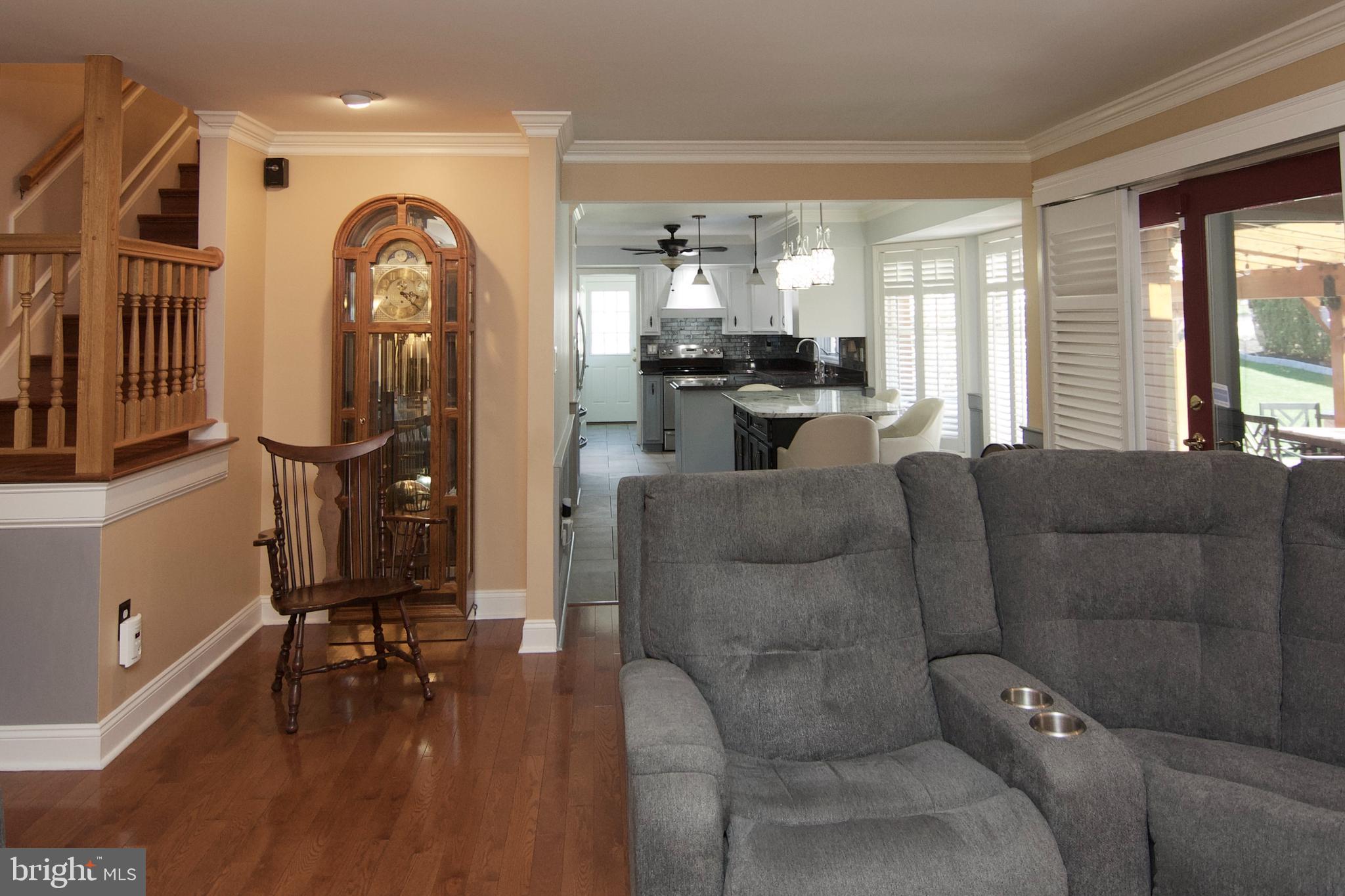 7451 Valley View Lane Reading, PA 19606 - Photo 23 of 61 a living room with furniture a flat screen tv and a floor to ceiling window