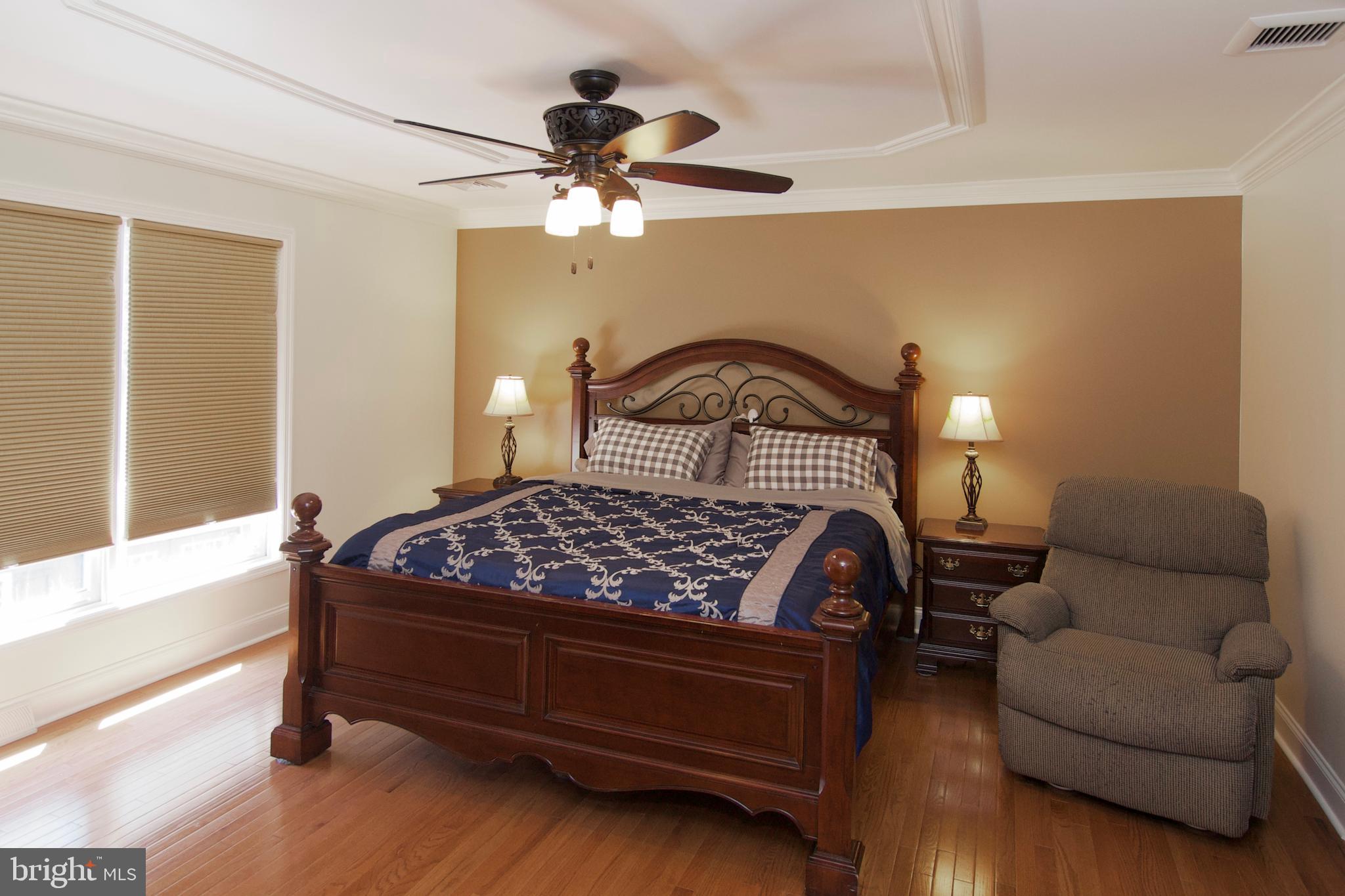 7451 Valley View Lane Reading, PA 19606 - Photo 28 of 61 a bedroom with a bed and wooden floor