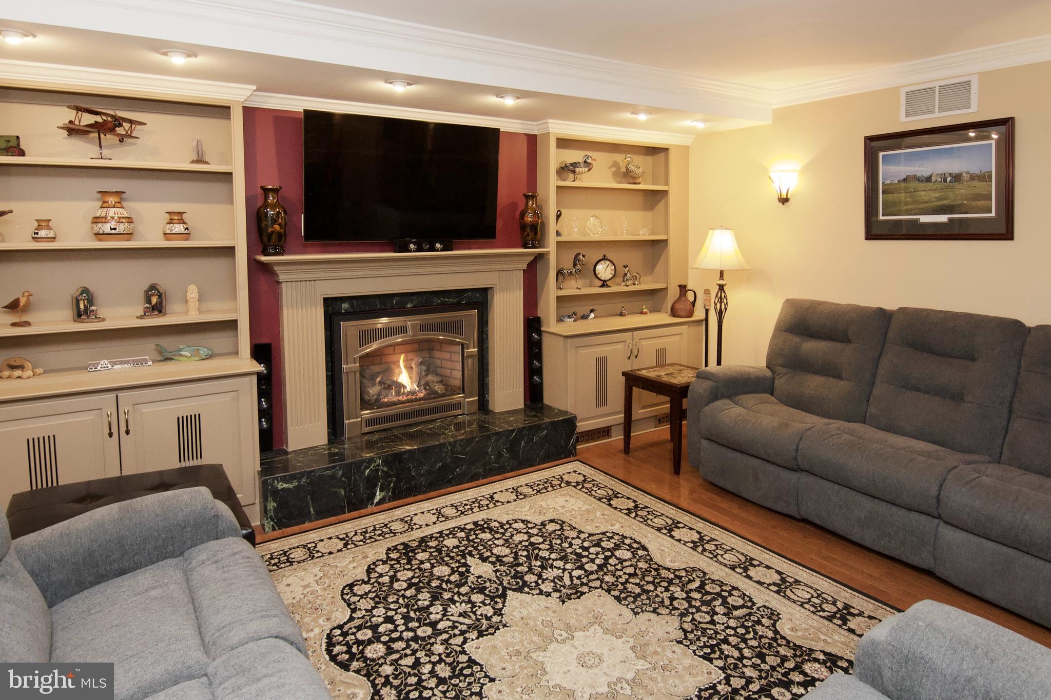 7451 Valley View Lane Reading, PA 19606 - Photo 8 of 61 a living room with furniture a flat screen tv and a fireplace