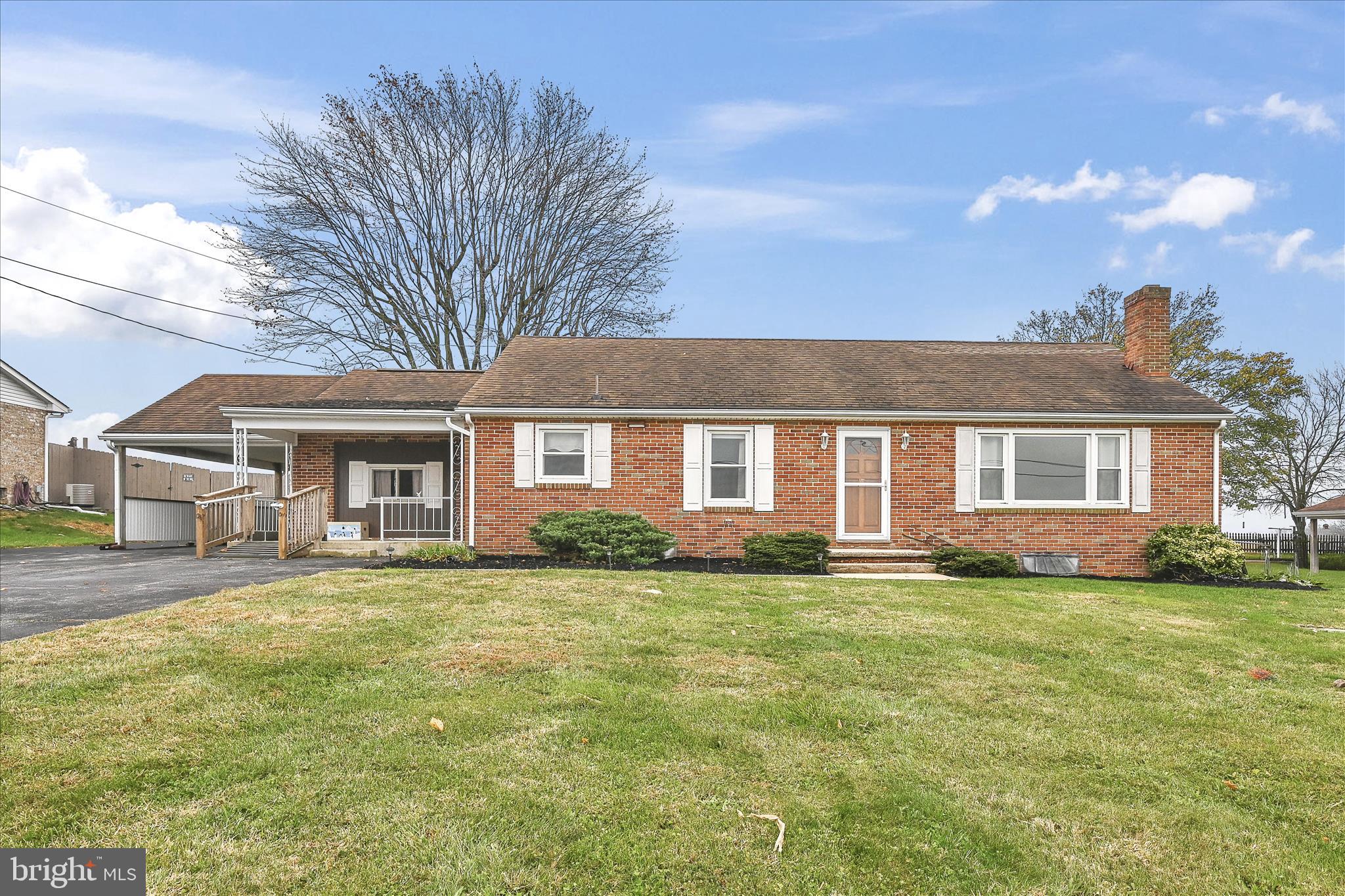 5030 Yorkana Road York, PA 17406 - Photo 3 of 31 a view of a yard in front of a house with large windows