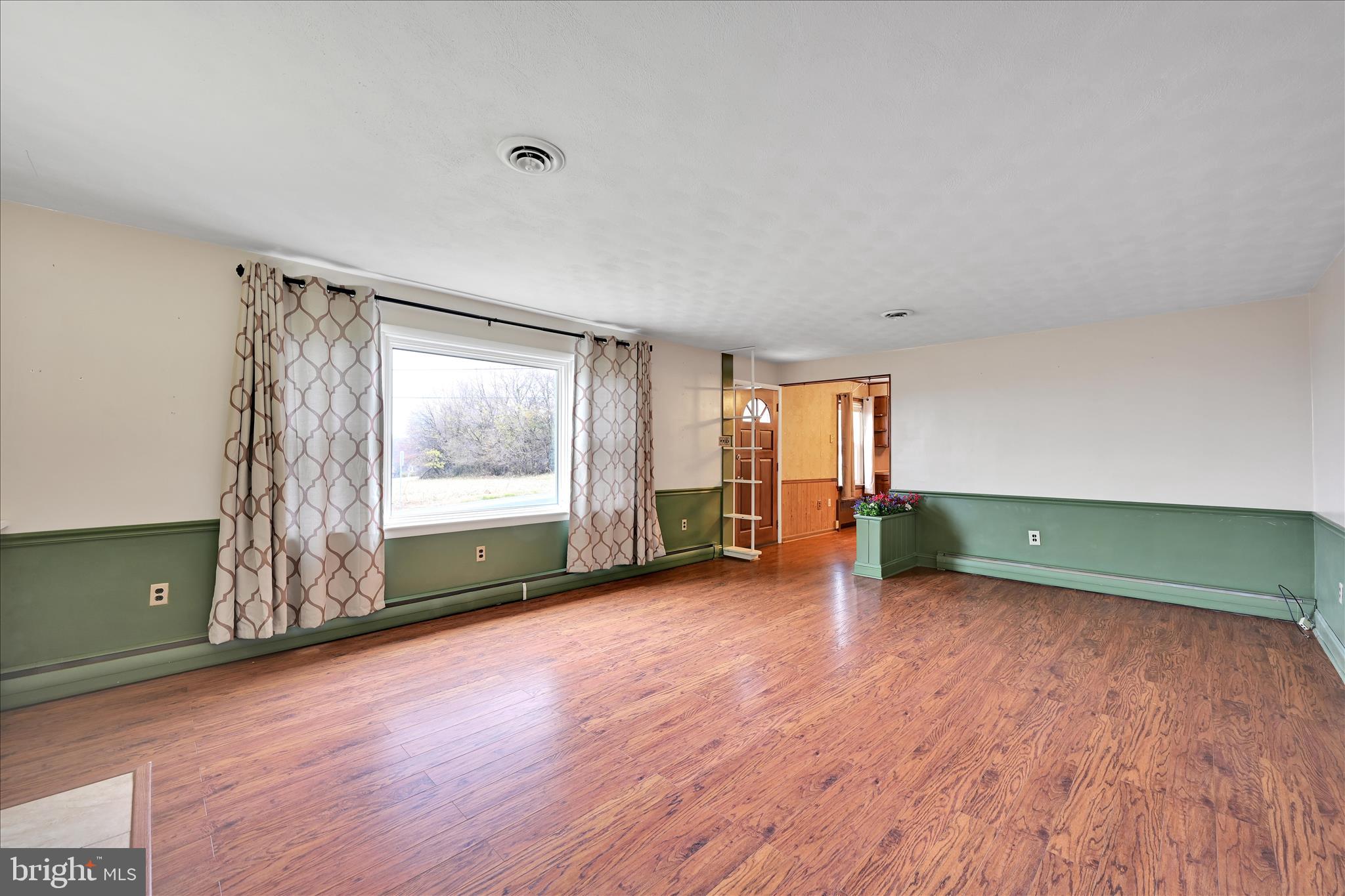 5030 Yorkana Road York, PA 17406 - Photo 8 of 31 a view of a livingroom with wooden floor and a window
